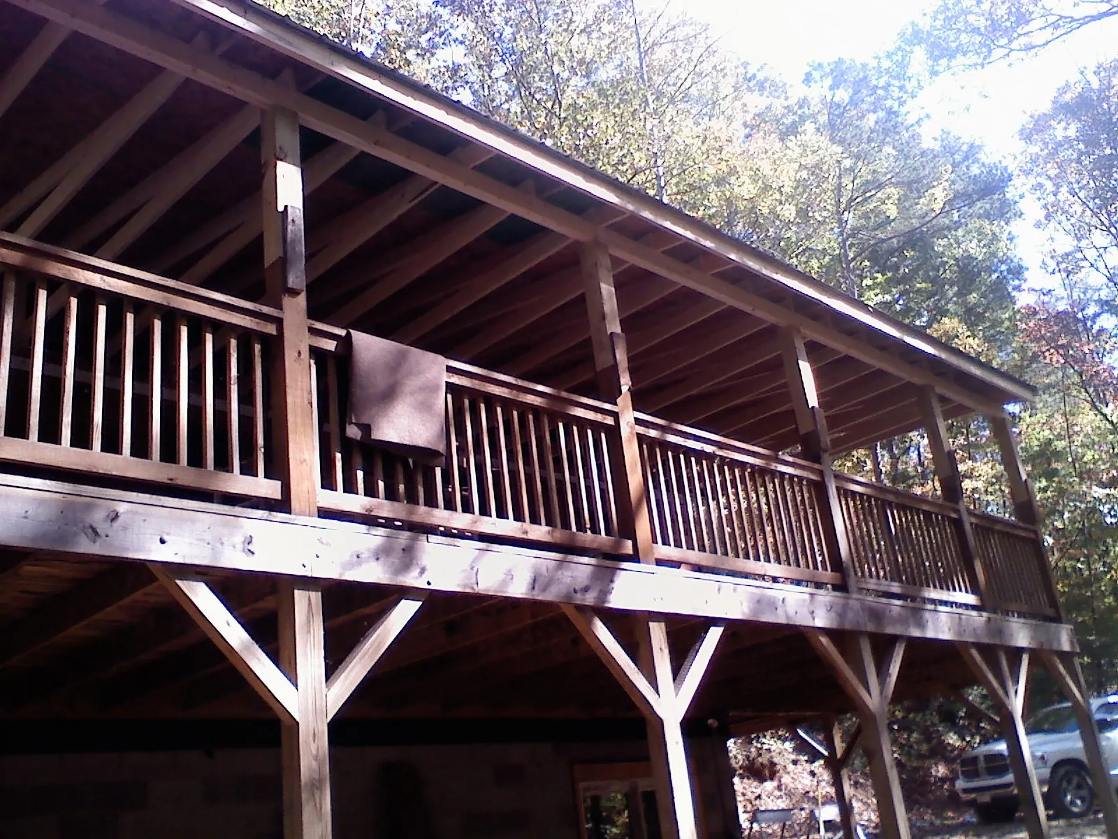 Timber framing under a new elevated porch and deck — Roof Leak Repair in Howard City by Roofing Brothers